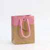Détail sac kraft naturel imprimé rose collection L'Exceptionnel Line pour boutique haut de gamme