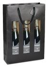 Sac kraft noir avec fenêtre pour 3 bouteilles, 175 g/m², avec poignées papier et carte message incluse. Élégant, solide et recyclable.