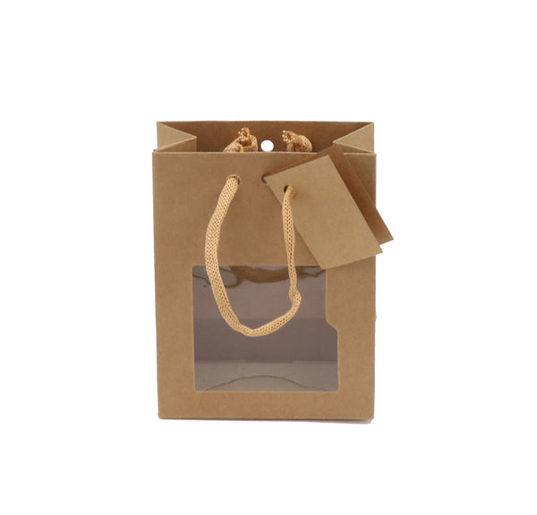 Sac vitrine vertical kraft brun avec fenêtre, 175 g/m², poignées cordelières et fond renforcé, carte cadeau incluse. Élégant et recyclable.